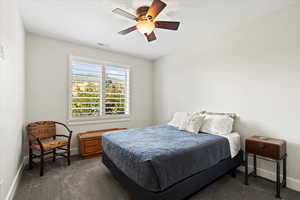 Bedroom 4 featuring carpet and ceiling fan