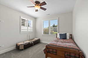 Bedroom 5 featuring carpet and ceiling fan