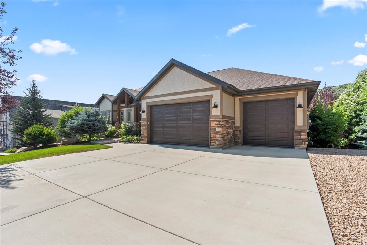 Craftsman inspired home featuring stone, siding and attached 3-car garage