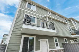 Rear view of house featuring a balcony