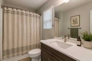 Virtually stage Bathroom featuring a vanity with an integrated sink, a brushed nickel faucet, and a large wall-mounted mirror