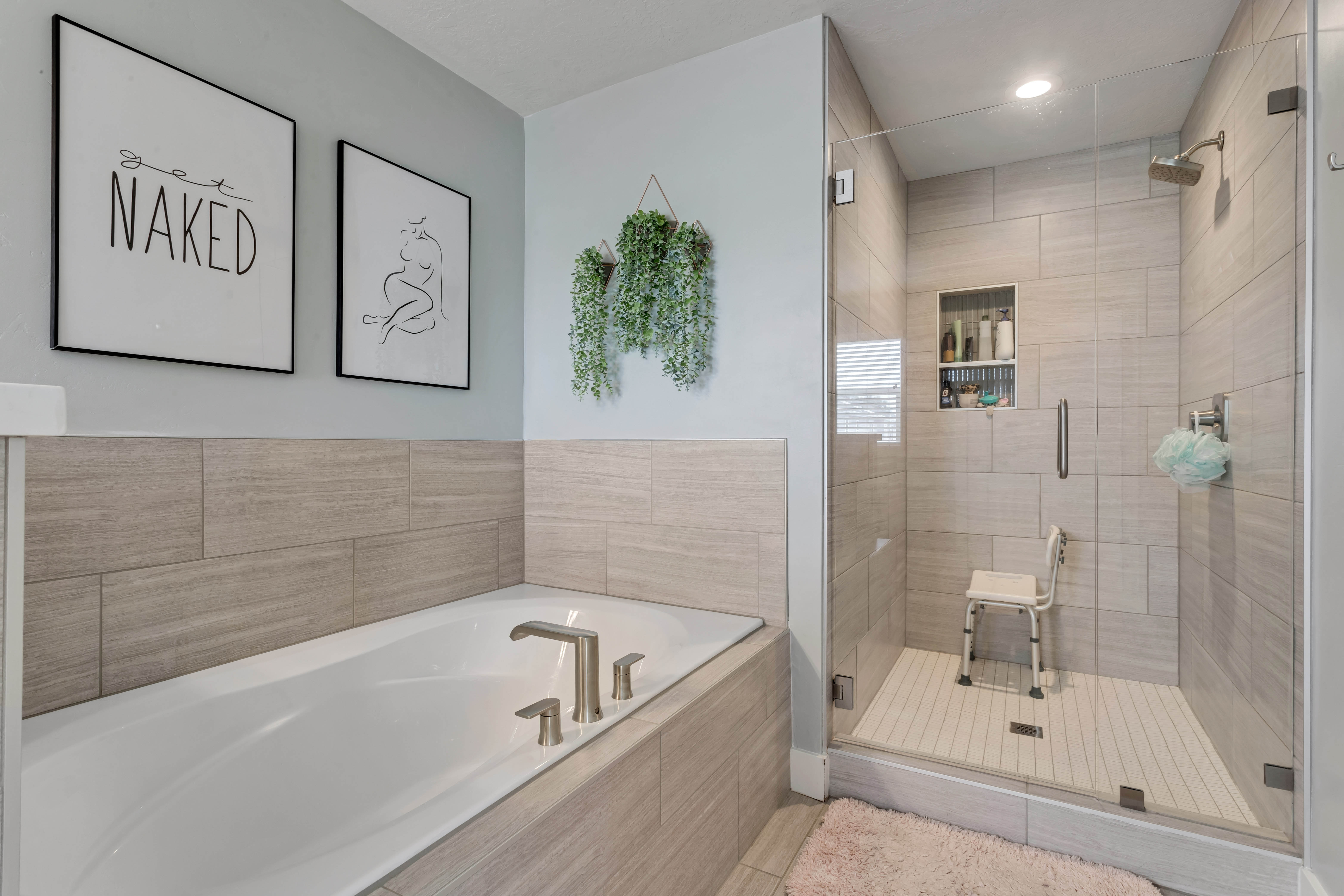 Bathroom featuring a garden tub, a shower stall, and recessed lighting