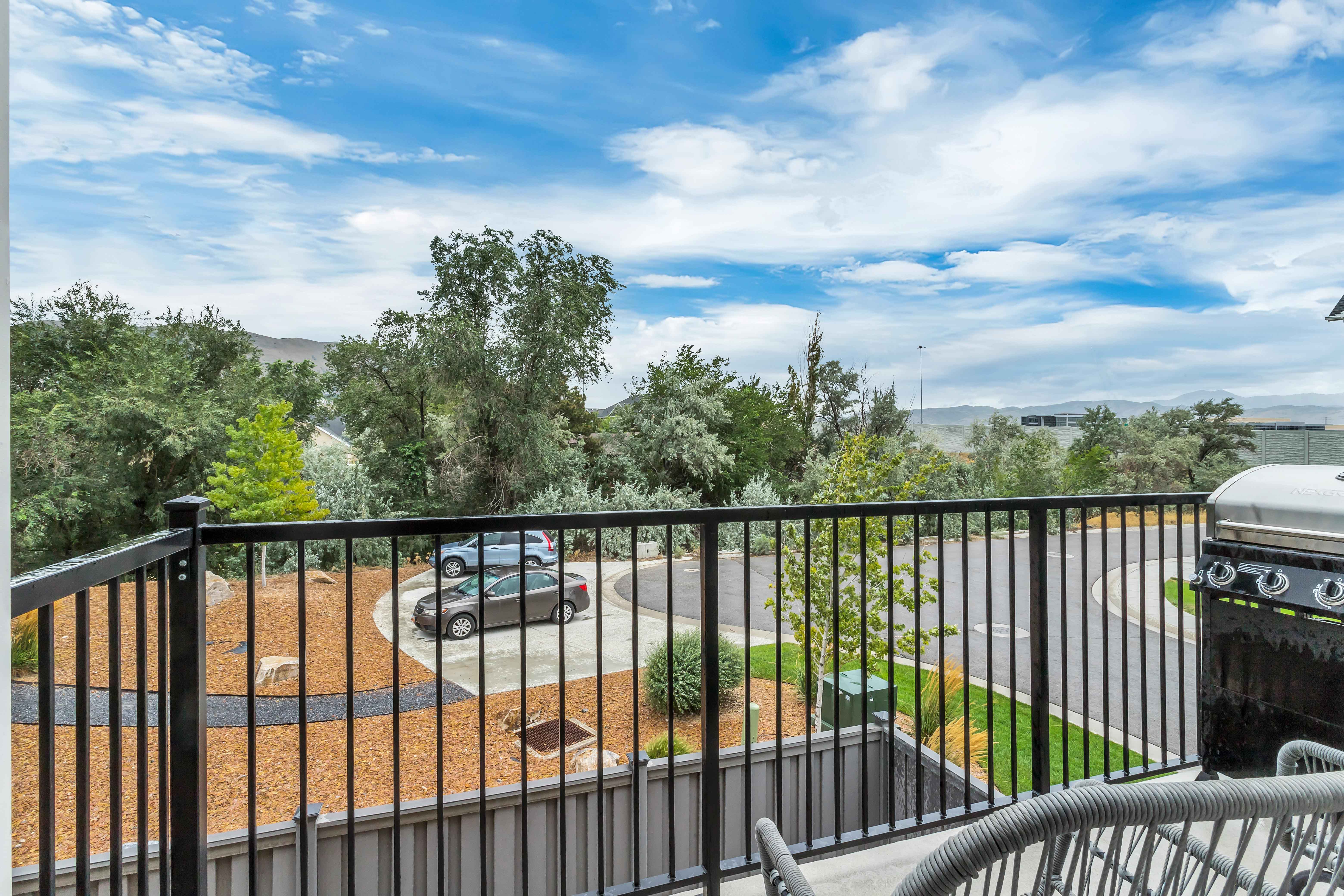 Balcony featuring area for grilling and a mountain view