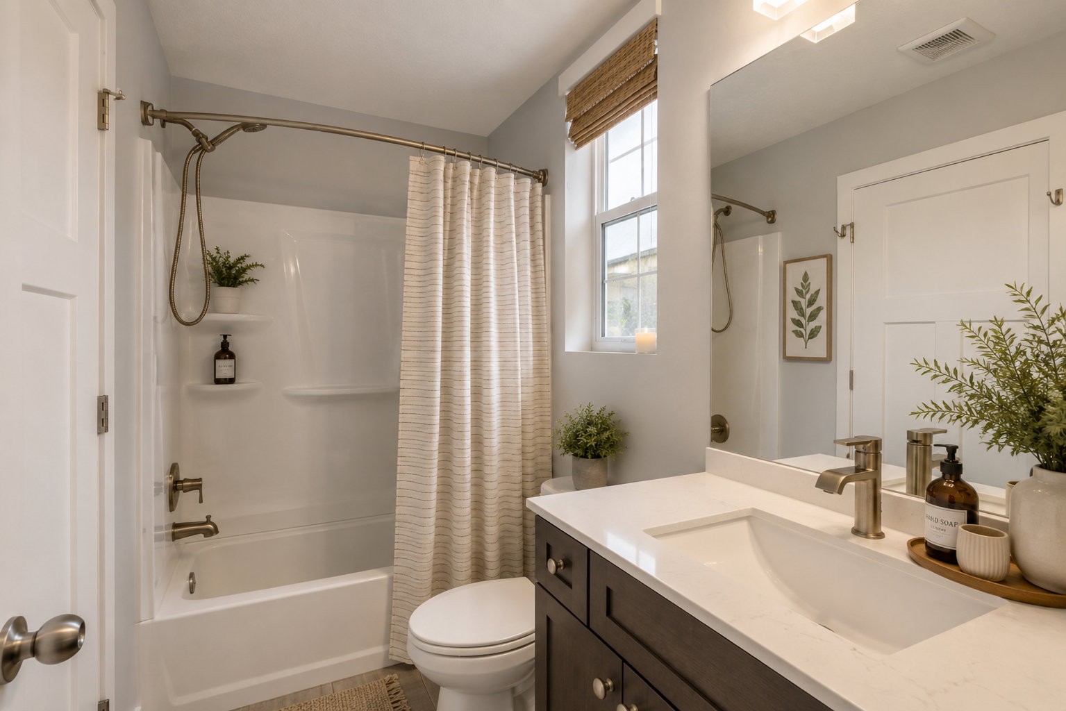 Virtually Staged Bathroom featuring a single vanity with a white countertop and undermount sink, brushed nickel faucet, and dark wood-finish cabinetry