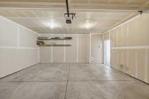 Garage featuring a garage door opener