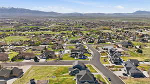 Aerial perspective of suburban area featuring a mountain backdrop