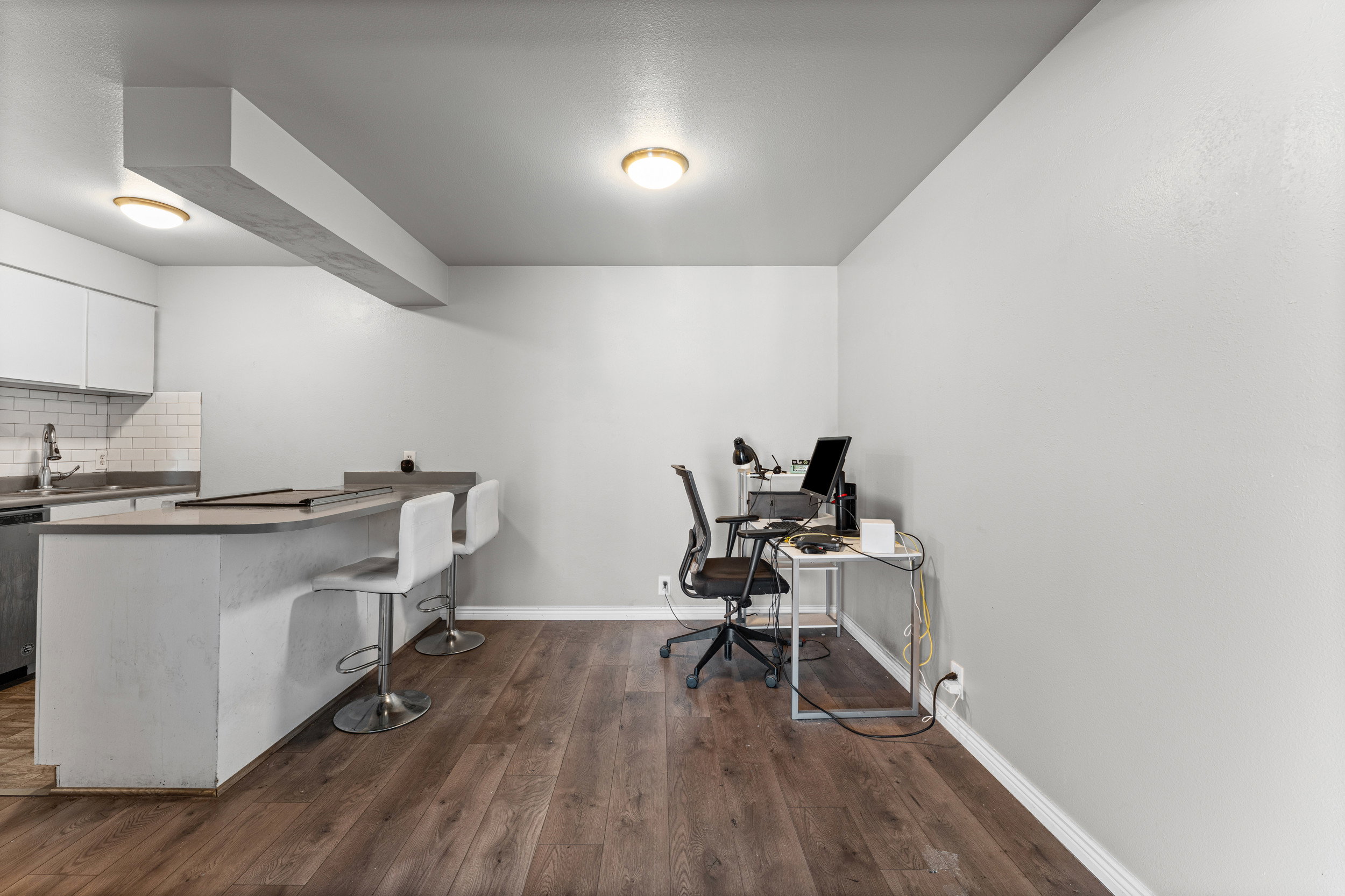 Office featuring dark wood finished floors and baseboards
