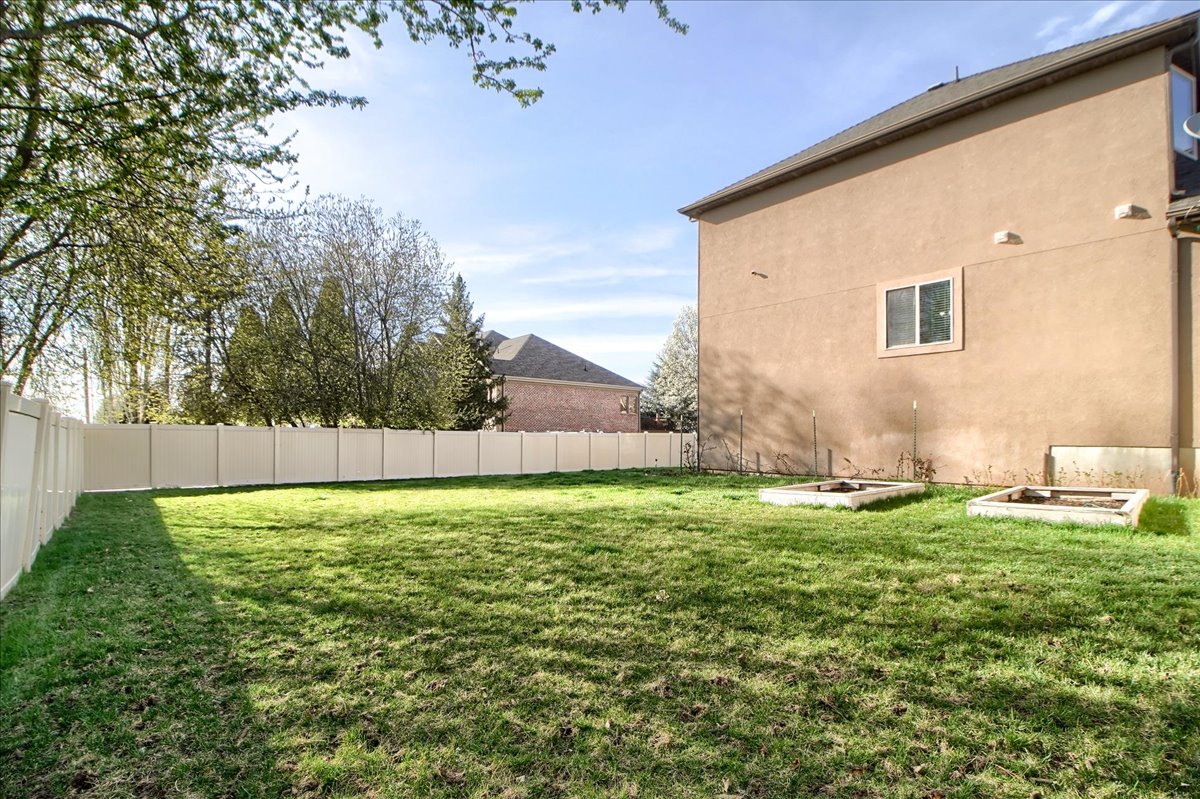 View of fenced backyard