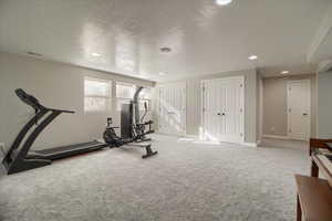 Exercise area featuring carpet floors and recessed lighting