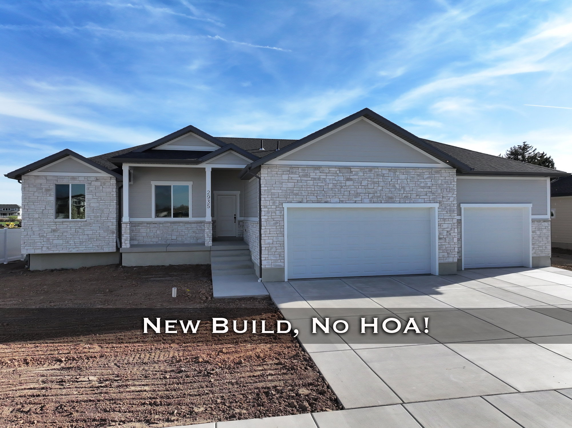 Single story home featuring a garage, covered porch, and concrete driveway