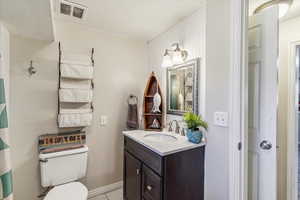 Full bathroom with vanity and curtained shower