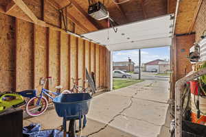 Garage featuring a garage door opener