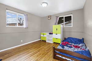 Bedroom featuring baseboards and light wood-style flooring