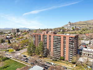 View of property with a mountain view and a view of city