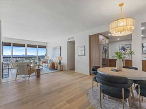 Dining space featuring light wood finished floors, a mountain view, and recessed lighting