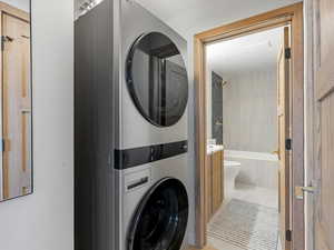 Laundry area featuring stacked washer and dryer
