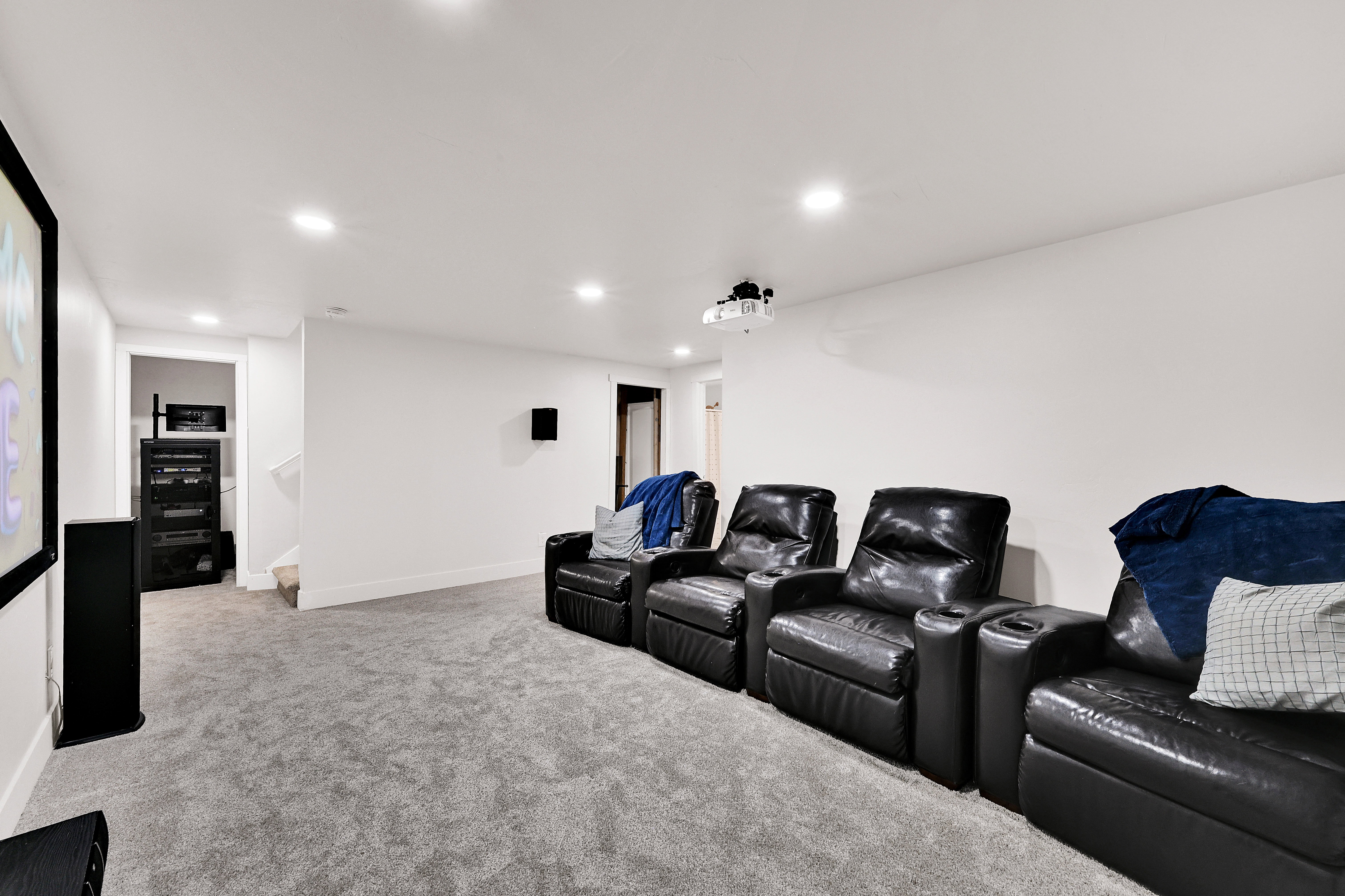 Cinema with light carpet and recessed lighting