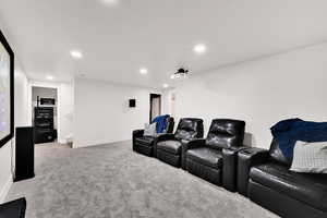 Cinema with light carpet and recessed lighting