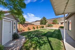 Fenced backyard featuring a patio area