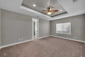 Unfurnished room with ceiling fan, light carpet, recessed lighting, and wooden ceiling