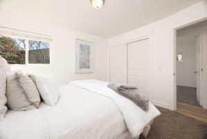 Bedroom with carpet and a closet