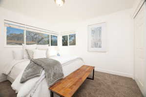 Carpeted bedroom with baseboards