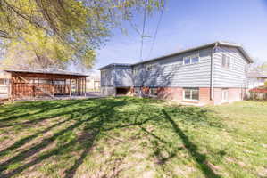 Rear view of house featuring a gazebo and a patio