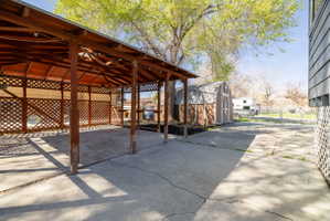 View of patio featuring an outdoor structure