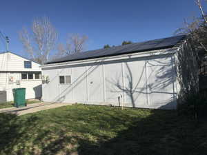 View of outbuilding with solar panels