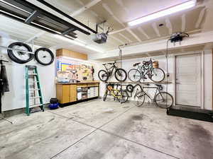 Garage with a workshop area and a garage door opener