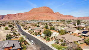 View of mountain backdrop featuring nearby suburban area