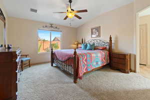Bedroom with light carpet and ceiling fan