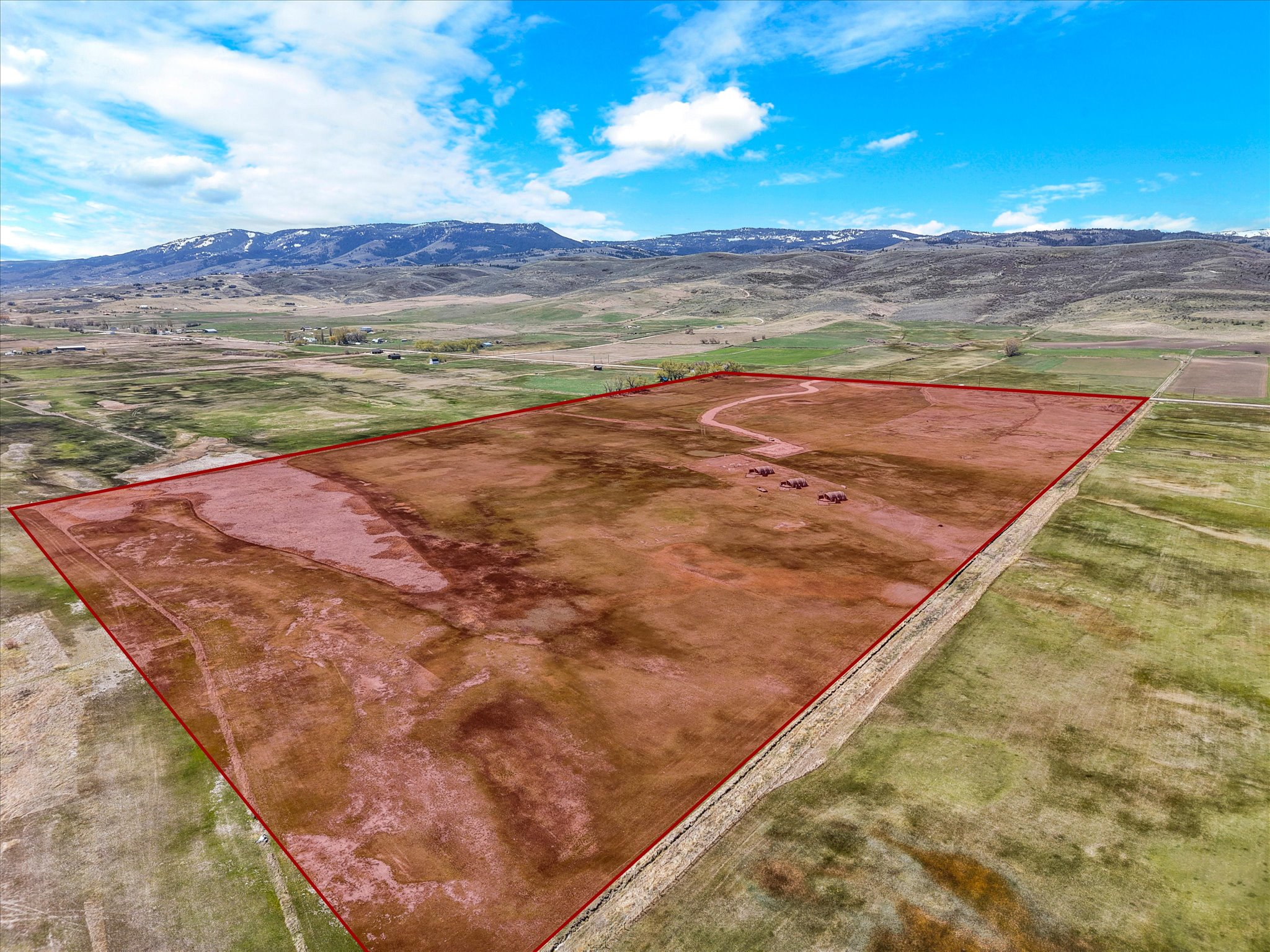 View of rural area with property parcel outlined and mountains