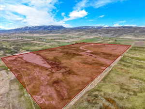 View of rural area with property parcel outlined and mountains