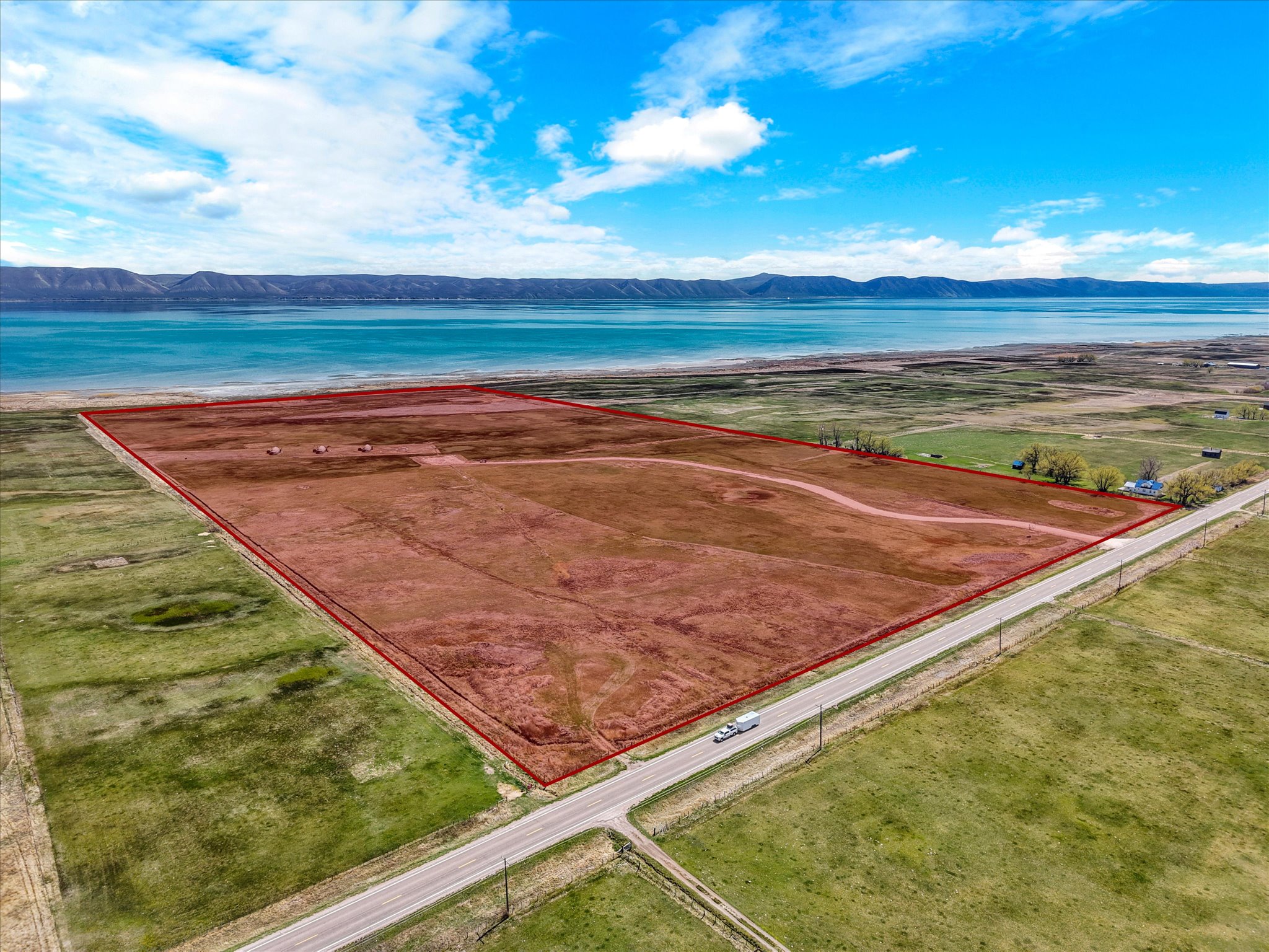 View of rural area featuring property parcel outlined and mountains