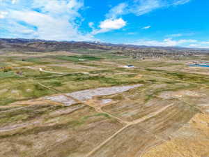 Aerial view of sparsely populated area featuring a mountain backdrop