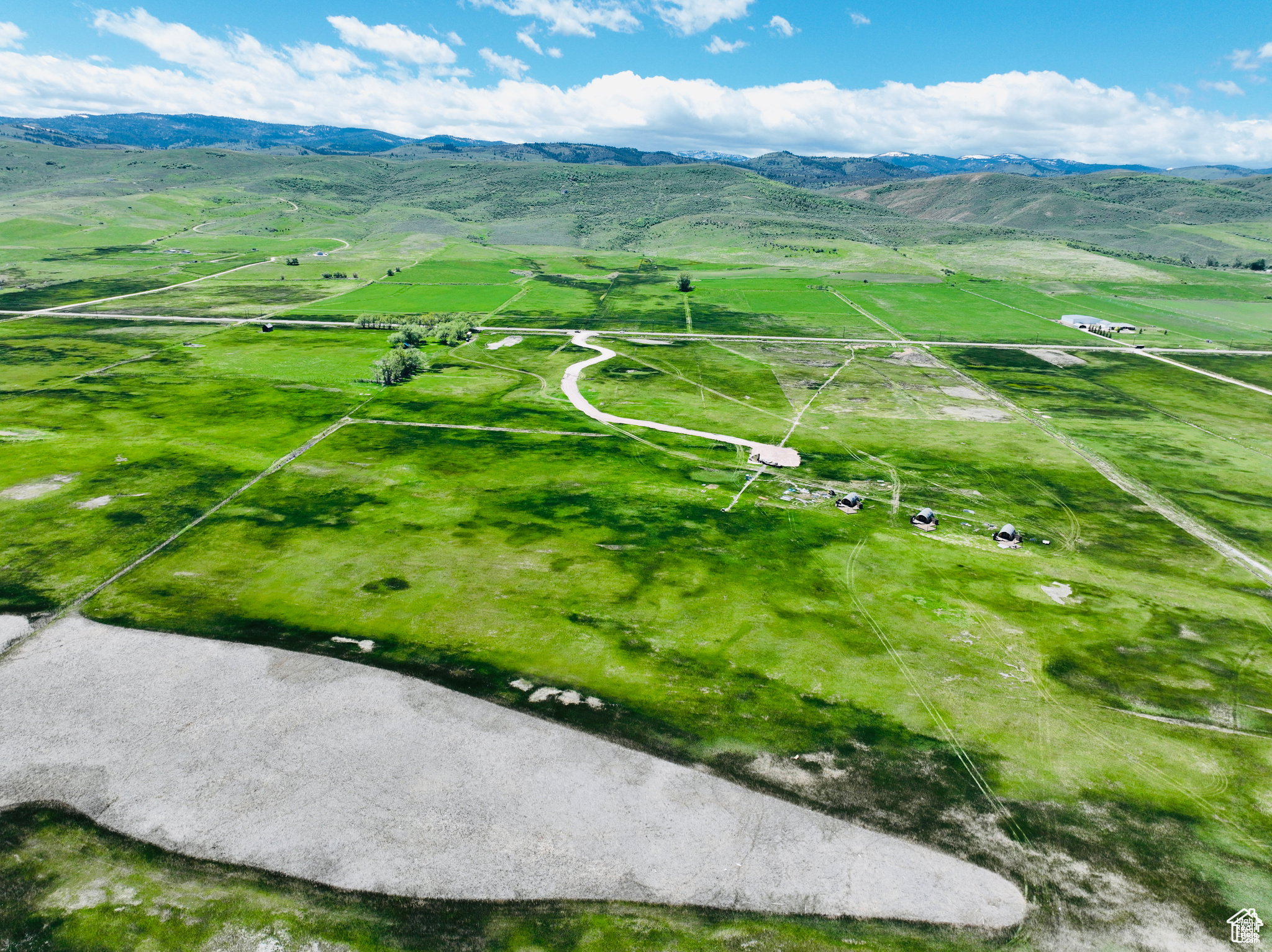 Aerial view of sparsely populated area with a mountain backdrop