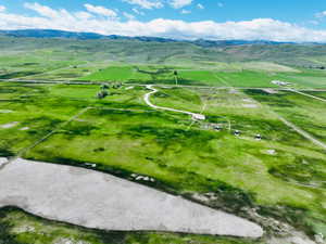 Aerial view of sparsely populated area with a mountain backdrop