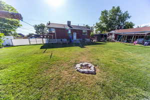 Back of house with a chimney