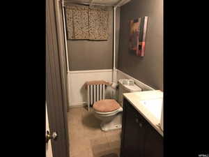 Bathroom featuring vanity and toilet