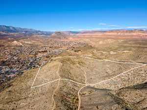 View of rural area featuring mountains and a desert landscape