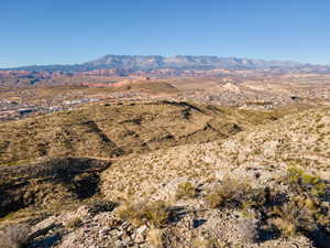 View of mountain backdrop with a desert landscape and rural landscape