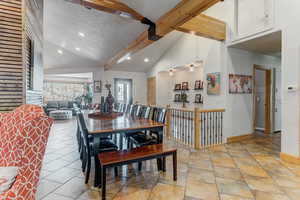 Dining area featuring recessed lighting and lofted ceiling