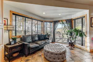 Living area with recessed lighting and baseboards