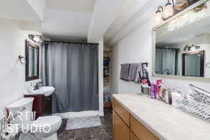 Full bathroom with vanity and toilet