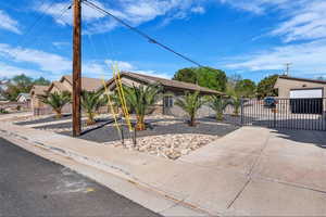 View of patio / terrace with a garage and a gate