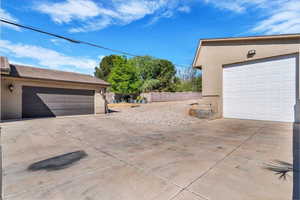 Detached garage with concrete driveway