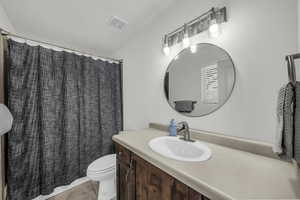 Bathroom featuring vanity and a shower with curtain