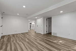 Unfurnished room featuring light wood finished floors and recessed lighting