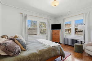 Upstairs bedroom with wood floors